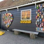 Wall in zaanse schans decorated with dutch clogs